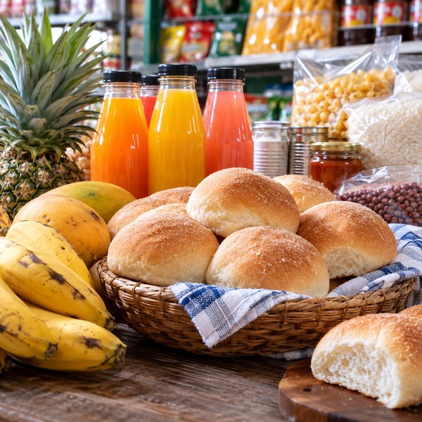 Fresh Filipino bread, bottled fruit drinks and packaged pantry food in a grocery display