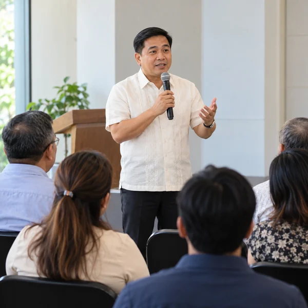 Religious community leader speaking at a small adult gathering