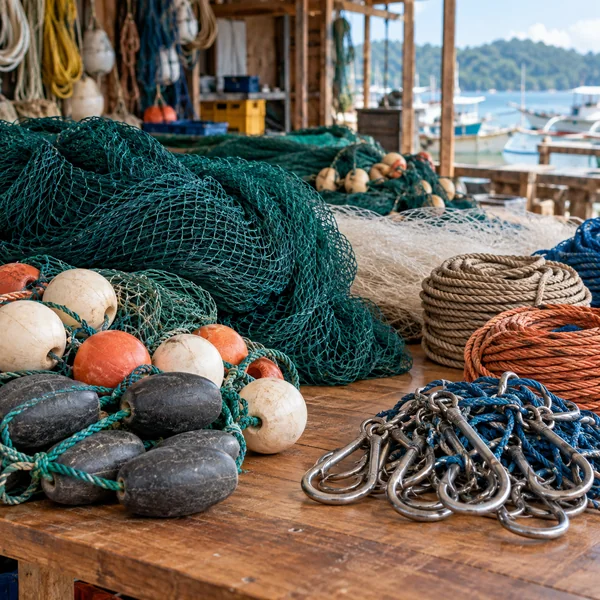 Fishing nets ropes and floats displayed in a coastal supply shop