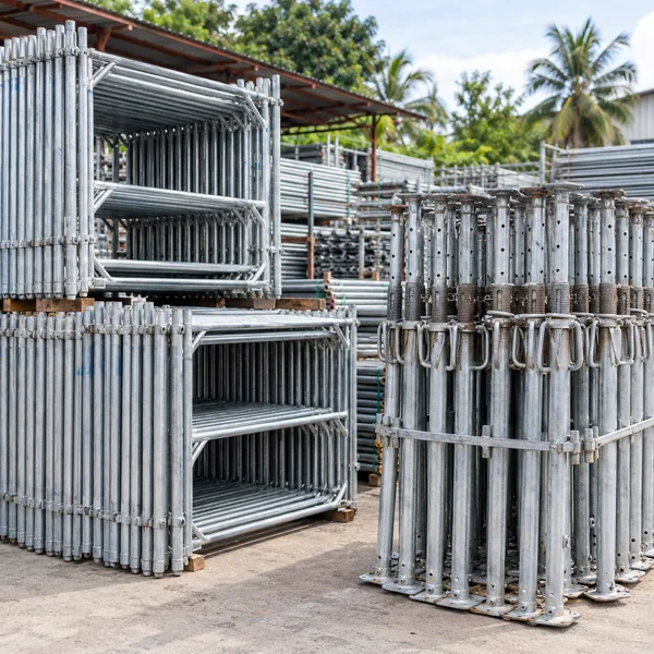 Steel scaffolding and adjustable props in an organized rental yard